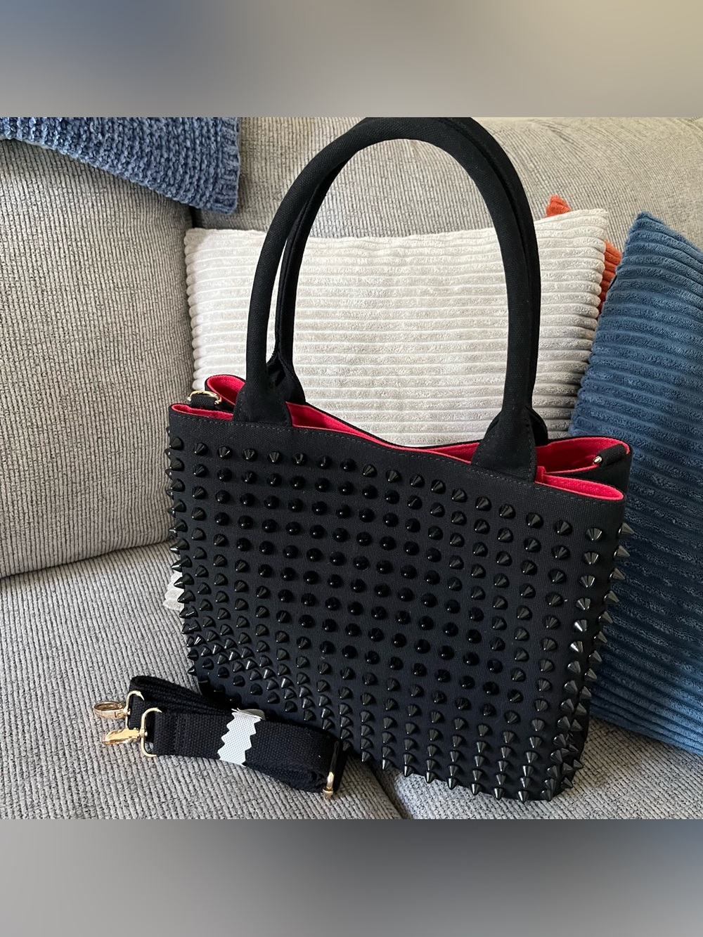 NWOT Black canvas spike studded tote with contrasting red interior